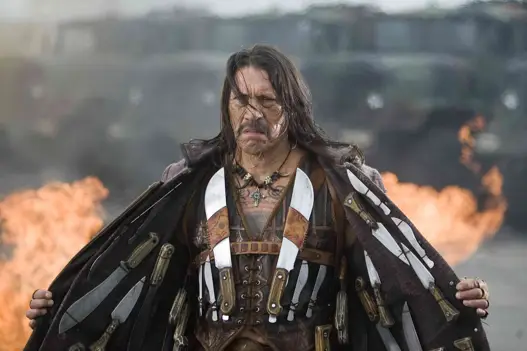Machete, an ex-Federale looking to avenge wrongs against him, was first introduced as a fake trailer during, Grindhouse, where the Robert Rodriguez and Quentin Tarantino paired their movies in a double bill, and then Rodriguez decided to make it an actual feature length film. Besides Rodriguez's cousin Danny Trejo in the lead role, there are many notable starsâRobert DeNiro as a Texas State Senator, Michelle Rodriguez as a taco truck owner, Don Johnson as a vigilante, Lindsay Lohan as a drugged out sexpot.  The Chicago Tribune's Michael Phillips thinks it sucks, "At 105 minutes, Machete is at least half an hour too long for its own good... Don't get me wrong: Robert Rodriguez and co-director Ethan Maniquis (a longtime Rodriguez colleague) waste no time with sober discussion of U.S. immigration policy, or a serious investigation into the matter of Jessica Alba and why she never seems to get any better as an actress... The beheadings and behandings and eye-gougings and stiletto-heel-in-the-craniums are diverting for a while."